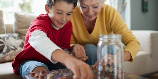child and grandparent counting coins
