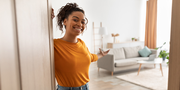 woman welcoming you into her home