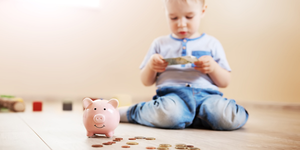 toddler with money