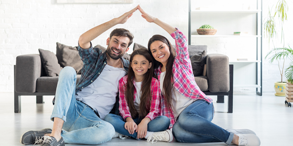 family making a house shape with arms